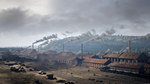 Mehrere Fabrikgebäude mit rauchenden Schorsteinen.