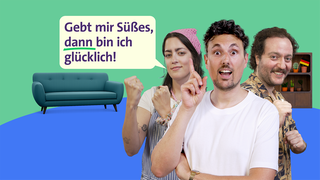 Host Gero schaut, als hätte er eine Idee, hinter ihm stehen zwei Personen, eine Sprechblase ploppt auf mit: Gebt mir Süßes, dann bin ich glücklich