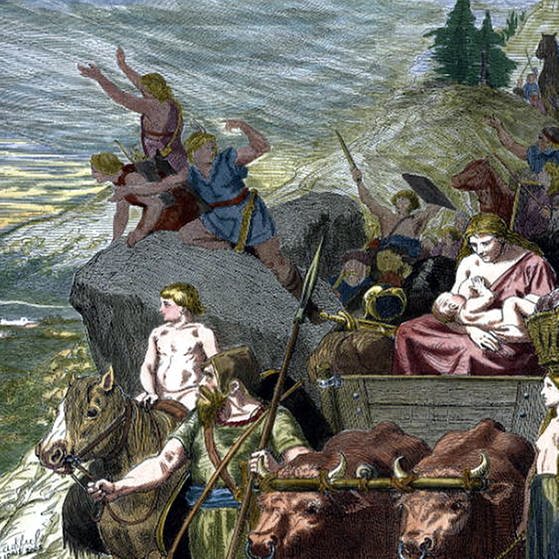 Gemälde wandernder Westgoten: Männer, Frauen und Kinder kommen mit Vieh und Wagen einen Berg herunter und schauen auf die Ebene.