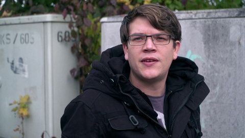 Felix in dunkler Jacke.