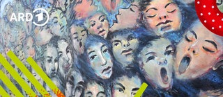 Malerei auf der East Side Galery mit Gesichtern.