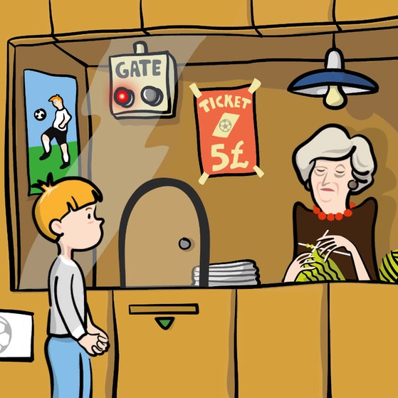 Ein Junge steht vor einem Ticketverkaufsgebäude eines Fußballspiels, in dem eine ältere Frau sitzt.