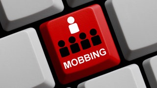 Computertaste mit der Aufschrift "Mobbing"