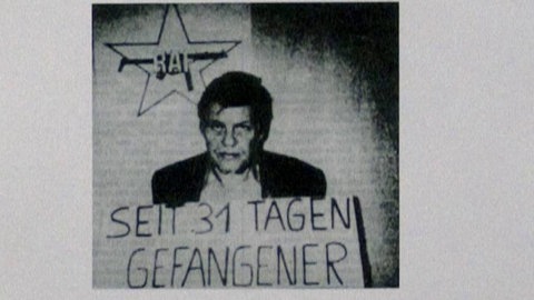 RAF-Plakat mit Bild von Hanns Martin Schleyer und Aufschrift: „Seit 31 Tagen Gefangener“
